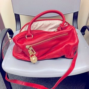 Michael Kors purse short straps as well one long detachable strap.